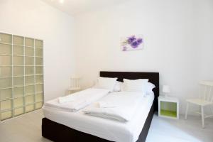 Posteľ alebo postele v izbe v ubytovaní Vienna-apartment-one Schmidgasse