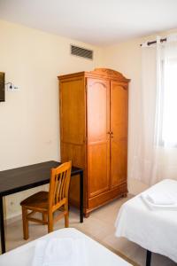 Posteľ alebo postele v izbe v ubytovaní El Roble Hotel Restaurante