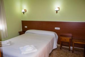 Posteľ alebo postele v izbe v ubytovaní El Roble Hotel Restaurante