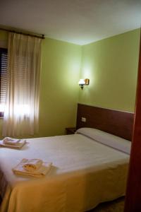 Posteľ alebo postele v izbe v ubytovaní El Roble Hotel Restaurante