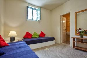 A bed or beds in a room at Summer House in Santorini