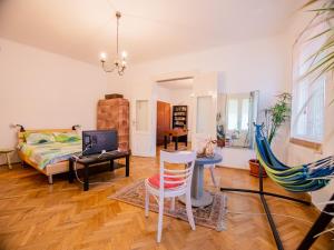 a living room with a couch and a table at Fresh Air Apartment in Braşov