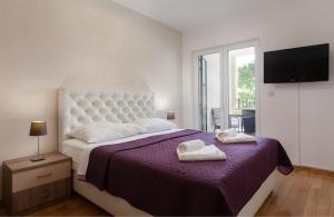 Postel nebo postele na pokoji v ubytování Apartment City Strand