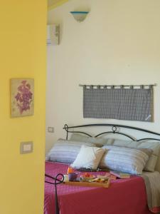 Postel nebo postele na pokoji v ubytování Agriturismo Sa Murta in Sennariolo-Oristano