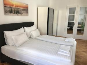 Posteľ alebo postele v izbe v ubytovaní Vienna-apartment-one Schmidgasse