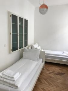 Posteľ alebo postele v izbe v ubytovaní Vienna-apartment-one Schmidgasse