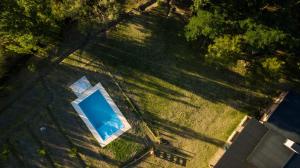 an overhead view of a swimming pool in the grass at Posada La Victoria in San Rafael