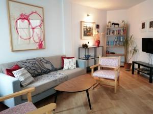 a living room with a couch and a table at El Artista in Grazalema