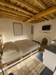 מיטה או מיטות בחדר ב-Aliya Konak - Köy Evi ve Lezzetleri