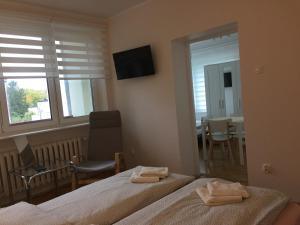Posteľ alebo postele v izbe v ubytovaní Apartamenty Przy Plaży Gdynia Orłowo