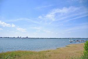 a large body of water with boats in it at Ferienwohnung Anne mit Sonnenterra in Altefähr