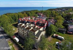 an aerial view of a building with a red roof at Apartamenty Turkusowe in Rowy