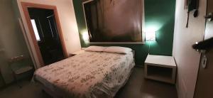 A bed or beds in a room at Guest House Roma Express