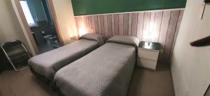 A bed or beds in a room at Guest House Roma Express