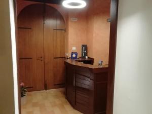 a hallway with a room with a desk and a door at Il Roccolo Di Valcerasa in Treia