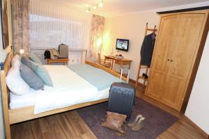 Postel nebo postele na pokoji v ubytování Hotel Kickert