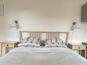 Postel nebo postele na pokoji v ubytování Gábriel Apartman