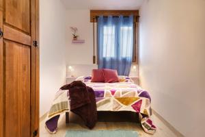 Postel nebo postele na pokoji v ubytování APARTAMENTO CASA PALOMA