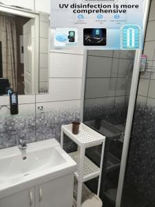 a bathroom with a sink and a mirror at Apartment by the park in Imatra +75 photos