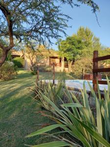 a wooden fence in front of a house at La Alquimia Casas de Campo in La Granja