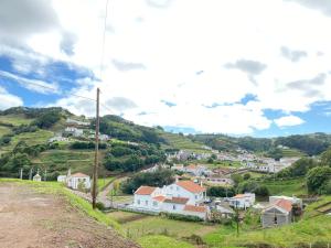 a small village on a hill with houses at Casa da Bisa - Santa Maria - Açores in Santa Bárbara