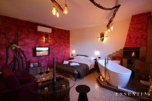 Postel nebo postele na pokoji v ubytování Agriturismo Essentia dimora rurale