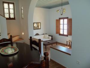 a living room with a table and a couch at Patmos Houses in Patmos