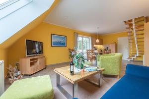 Μια τηλεόραση ή/και κέντρο ψυχαγωγίας στο Ferienhaus Lütten Kulli - 1