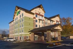 a rendering of a hotel with a parking lot at Holiday Inn Express & Suites - Seattle South - Tukwila, an IHG Hotel in Tukwila