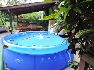 a large blue tub with balls in it at Castelo da Ilha in Florianópolis