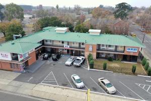 an overhead view of a parking lot in front of a building at Stay Inn Suite in Stockton