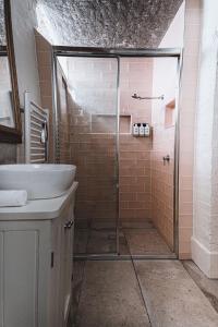 a bathroom with a shower and a sink at Campbell House in Castlemaine