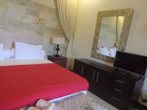 Кровать или кровати в номере Oase Van Java