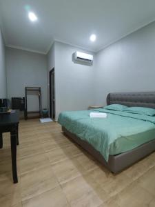 Katil atau katil-katil dalam bilik di Faris's Homestay & Resort