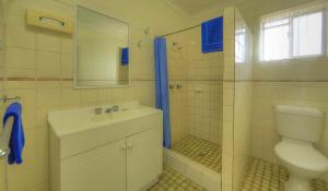 a bathroom with a toilet and a sink and a shower at Sunlover Lodge in Kinka +32 photos