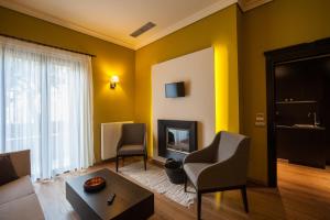 TV a/nebo společenská místnost v ubytování Levidi Suites