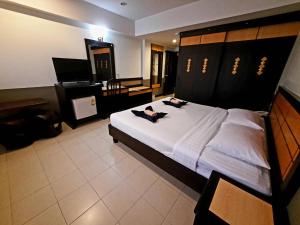 Postel nebo postele na pokoji v ubytování Ariya inn Chiangrai