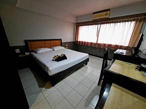 Postel nebo postele na pokoji v ubytování Ariya inn Chiangrai