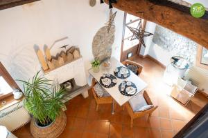 an overhead view of a living room with a table and a fireplace at Stop & Sleep Fagagna on the Hills in Fagagna