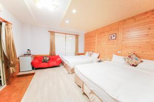 A bed or beds in a room at Dong Shan He B&B