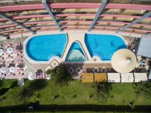 an overhead view of a swimming pool in a building at Flamingo Hotel Sunny Beach in Sunny Beach