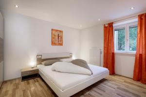 Ένα ή περισσότερα κρεβάτια σε δωμάτιο στο Apartment Viktoria +34 φωτογραφίες