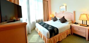 Voodi või voodid majutusasutuse Emerald Puteri Hotel toas