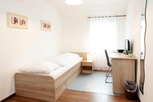 Katil atau katil-katil dalam bilik di Hotel Goldener Löwe