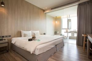 Voodi või voodid majutusasutuse Hotel Day Plus Teascape toas