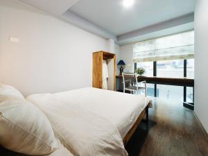 Letto o letti in una camera di Ha Noi Re Hostel