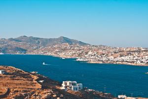 a view of a city and a body of water at Vista Infinita in Agios Ioannis Mykonos