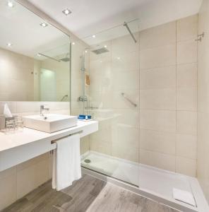 a bathroom with a sink and a shower at Globales Don Pedro - Adults Only in Cala de Sant Vicent