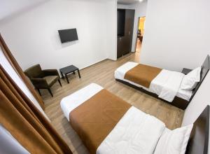 Ένα ή περισσότερα κρεβάτια σε δωμάτιο στο Алатау