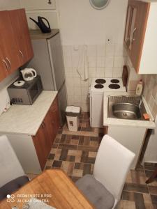 a small kitchen with a sink and a stove at Lucka in Ústí nad Labem